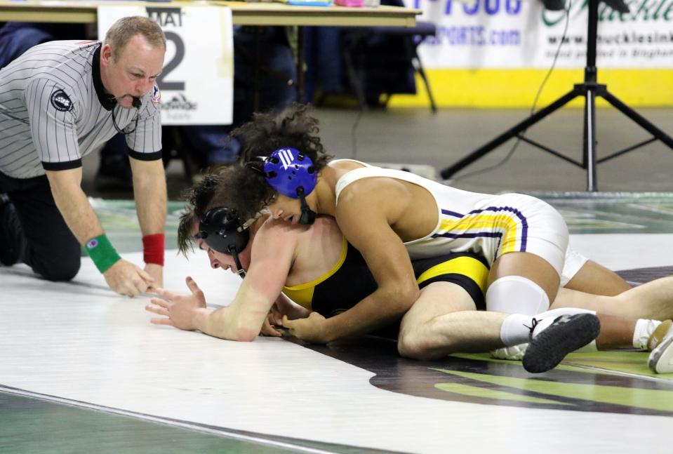 Tioga's Ousmane Duncanson, top, beat Windsor's Garrett Bidwell by injury default after leading 10-1 in the Division II 160-pound final at the Section 4 wrestling championships Feb. 11, 2023 at Visions Veterans Memorial Arena in Binghamton.