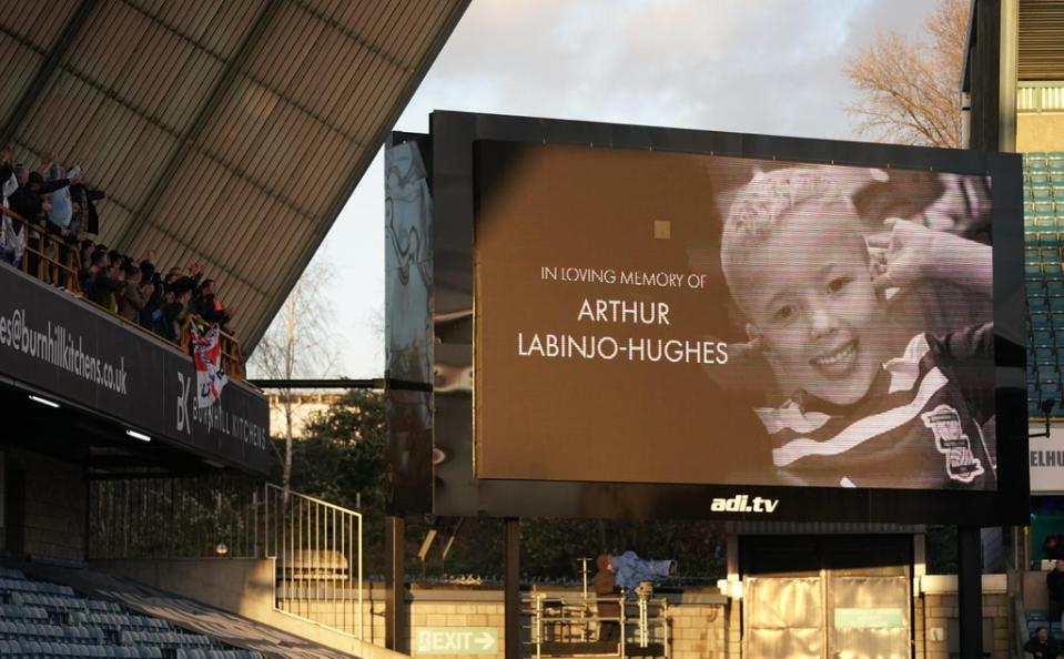 A memorial for Arthur Labinjo-Hughes is shown on the big screen before the Sky Bet Championship match at The Den, London (PA) (PA Wire)