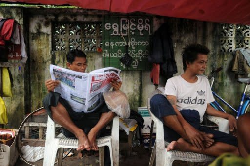 A Myanmar man reads a local journal in Yangon on August 20, 2012. Myanmar says it has abolished media censorship, delighting journalists who have lived for decades under the shadow of the censors' marker pen