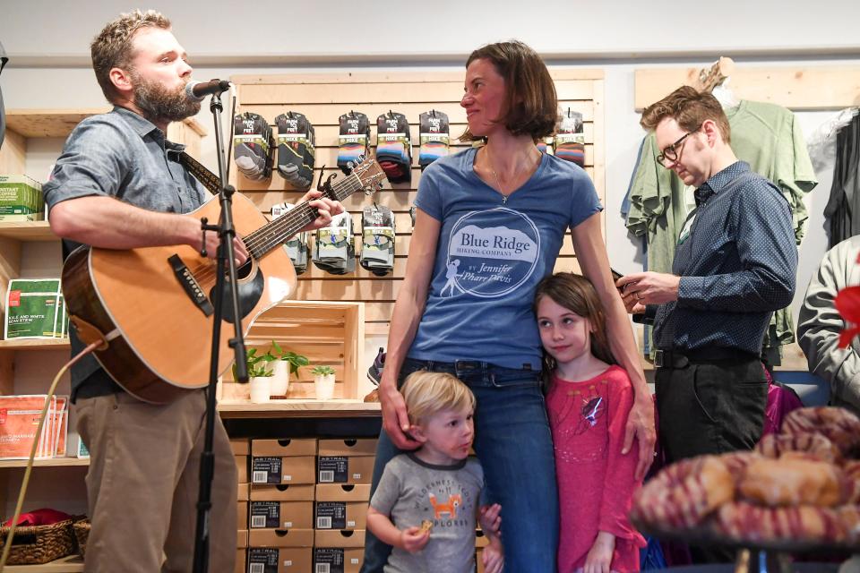 Jennifer Pharr Davis, seen here with her children in 2019 at the opening of her hiking shop in downtown Asheville, was in an accident recently when her car hit a black bear on I-26.
