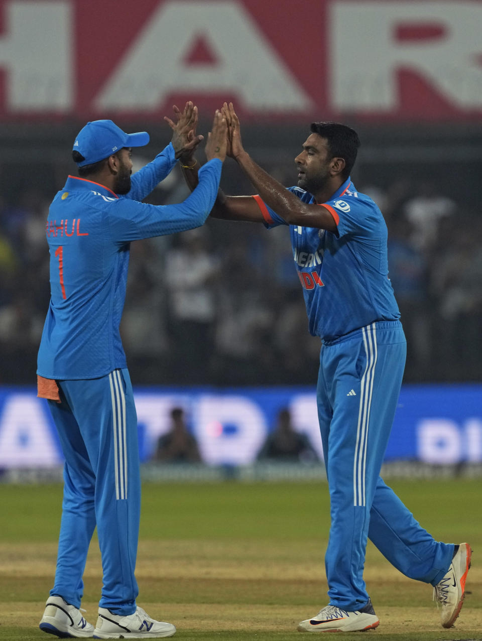 India's Ravichandran Ashwin, right, celebrates with captain KL Rahul the dismissal of Australia's Marnus Labuschagne during the second one day international cricket match between India and Australia in Indore, India, Sunday, Sept. 24, 2023. (AP Photo/Ajit Solanki)