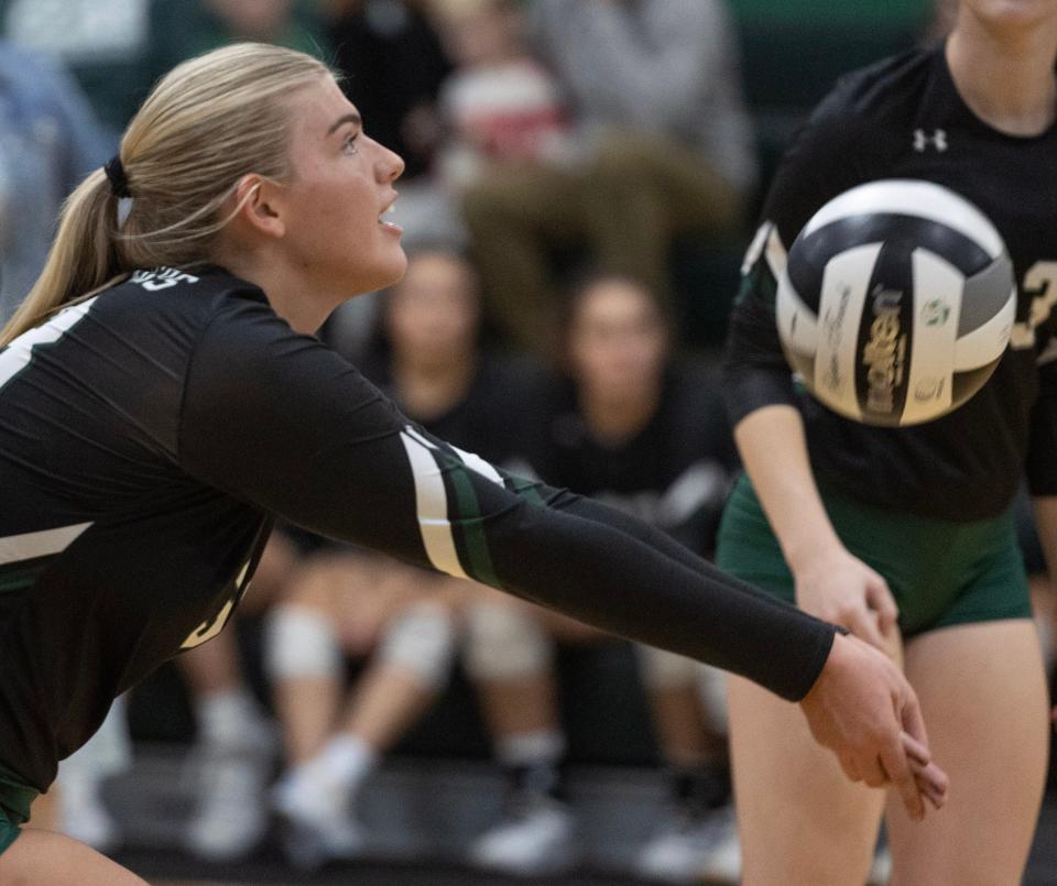 Central Catholic's Madison Heiser hits a dig against St. Thomas Aquinas at Central Thursday, October 12, 2023.