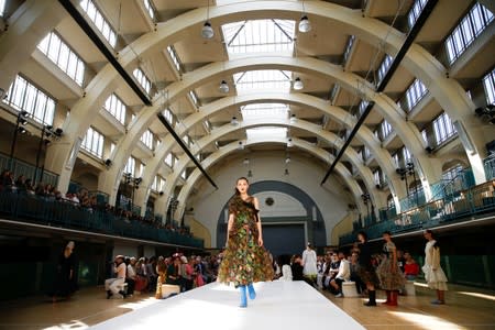 Models present creations during the Molly Goddard catwalk show during London Fashion Week in London