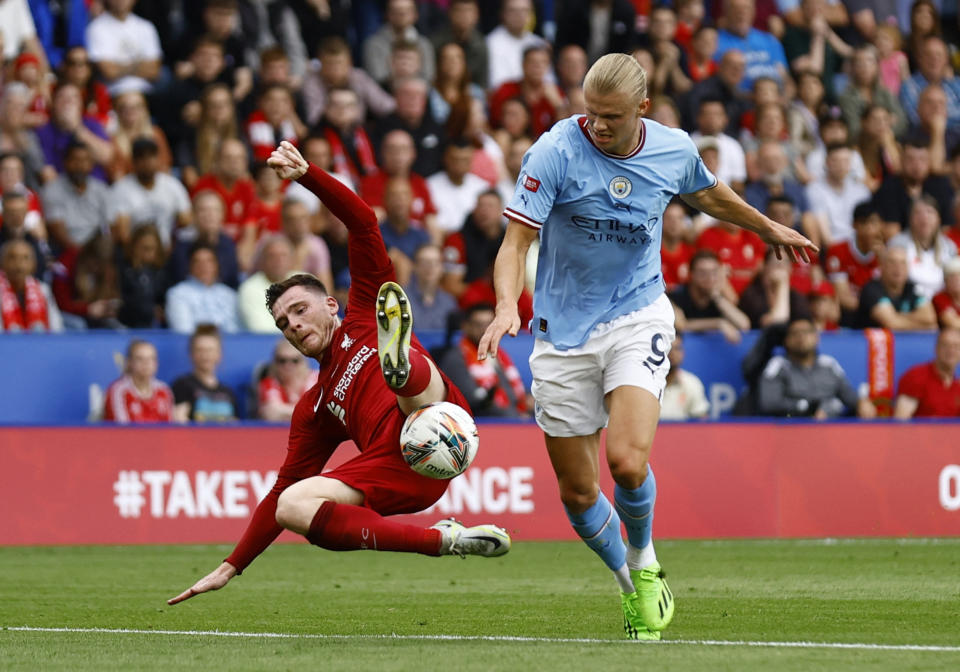 Liverpool's Andrew Robertson (left) battles with Manchester City's Erling Haaland during the 2022 Community Shield match.