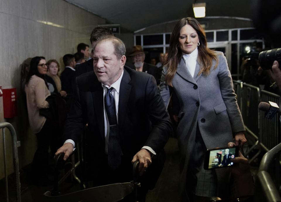 Harvey Weinstein leaves Manhattan Criminal Court as a jury deliberates on Feb. 21, 2020. New York's highest court has overturned the Hollywood producer's conviction on sex crime charges and ordered a new trial, citing errors in the way the trial had been conducted, including admitting the testimony of women who were not part of the charges against him.