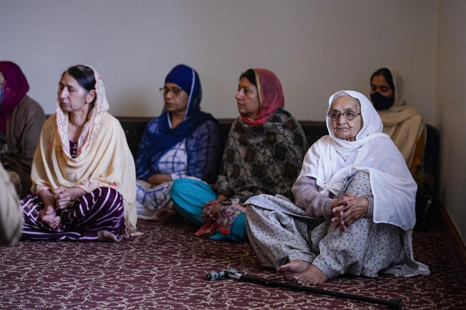 Members of the Sikh Coalition gather at the Sikh Satsang of Indianapolis in Indianapolis, Saturday, April 17, 2021 to formulate the groups response to the shooting at a FedEx facility in Indianapolis that claimed the lives of four members of the Sikh community. A gunman killed eight people and wounded several others before taking his own life in a late-night attack at a FedEx facility near the Indianapolis airport. (AP Photo/Michael Conroy)