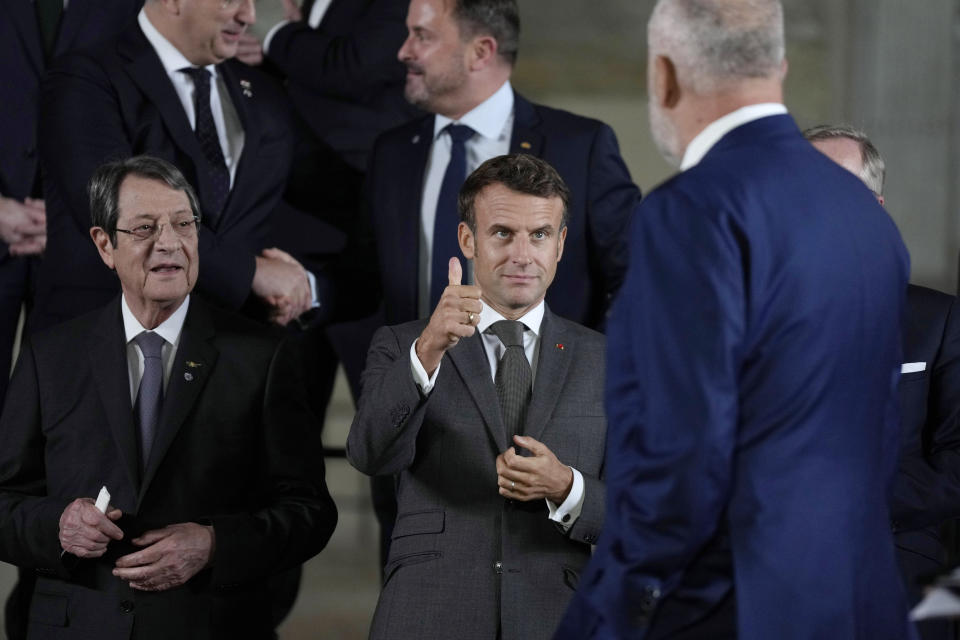 France's President Emmanuel Macron, center, gestures to Albania's Prime Minister Edi Rama, second right, at a group photo during a meeting of the European Political Community at Prague Castle in Prague, Czech Republic, Thursday, Oct 6, 2022. Leaders from around 44 countries are gathering Thursday to launch a "European Political Community" aimed at boosting security and economic prosperity across the continent, with Russia the one major European power not invited. (AP Photo/Alastair Grant, Pool)