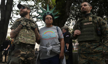 Members of the California III Percent provide security during the Patriots Day Free Speech Rally in Berkeley, California, U.S. April 15, 2017. REUTERS/Jim Urquhart