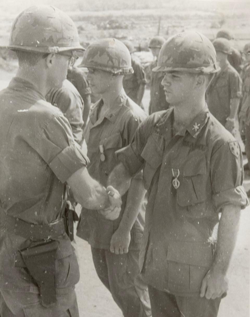 U.S. Army Lt. William "Bill" Theiss, right, is welcomed into the service in 1966 by Lt. Col. Pilk during a promotion ceremony.
