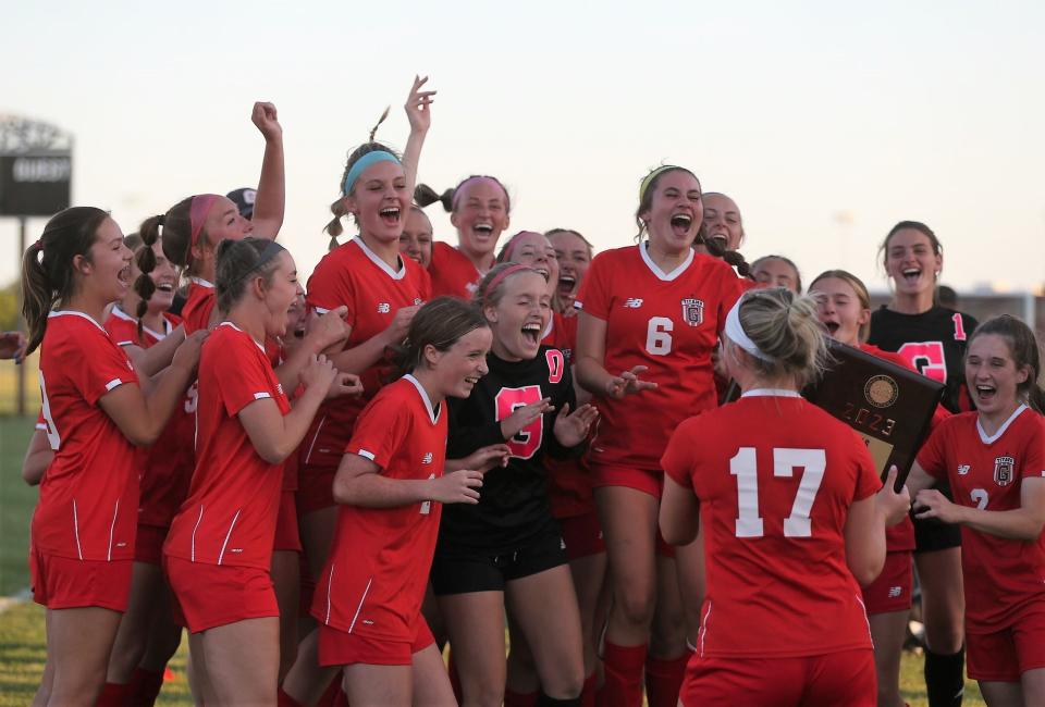 Chatham Glenwood celebrate its third straight sectional title following its 1-0 girls soccer victory over Rochester in the Class 2A Normal West Sectional final on Friday, May 26, 2023.