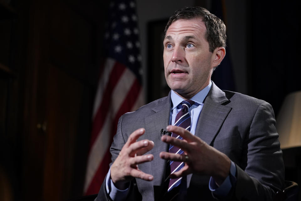 Rep. Jason Crow, D-Colo., talks during an interview with The Associated Press in his office on Capitol Hill in Washington, Wednesday, Dec. 15, 2021, looking back a year later at his experience during the Jan. 6 Capitol insurrection. (AP Photo/Susan Walsh)