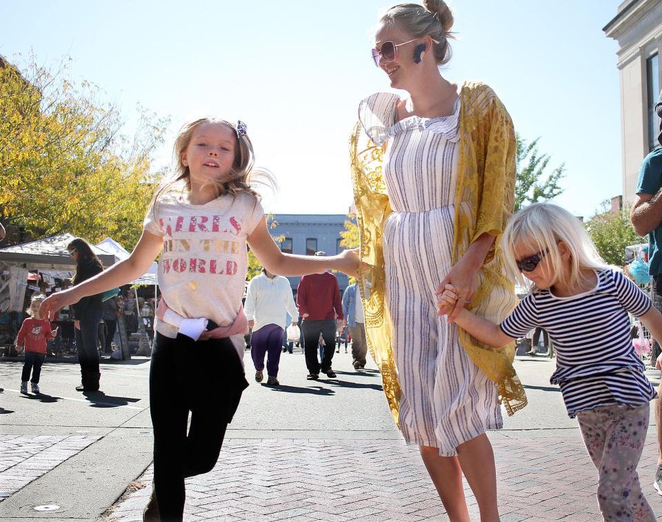 Lydia, Eliana and Alinah Vester dance during the 2020 Main Street Festival in Gallatin.