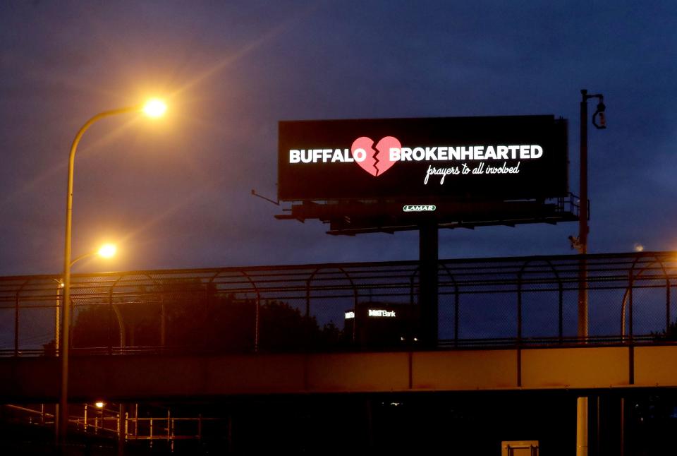 An electronic billboard in Buffalo, N.Y., seen May 17, 2022, expresses the sentiment of many in this city after a gunman shot and killed ten Black residents of the city in a supermarket this past weekend. 