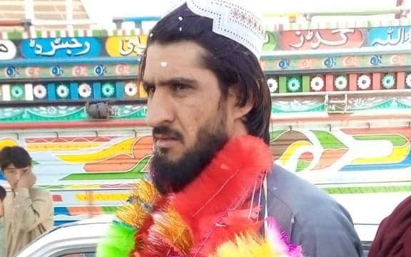 Taliban prisoner Sher Agha Muhammad Khan garlanded as he is greeted by relatives in Quetta