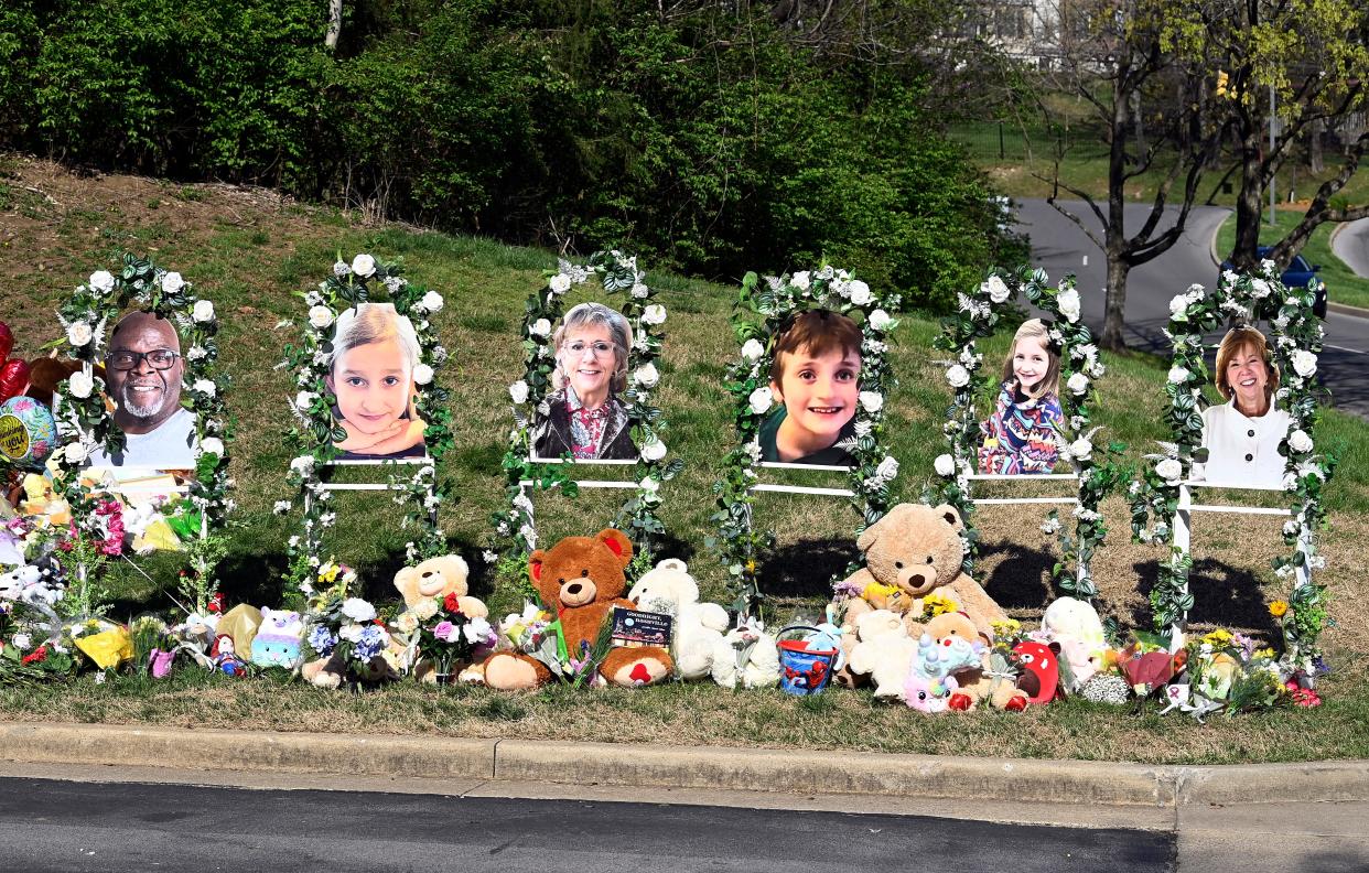 Photographs of Mike Hill, left, Evelyn Dieckhaus, Katherine Koonce, William Kinney, Hallie Scruggs, and Cynthia Peak were placed at a makeshift  memorial by the entrance to the Covenant School Thursday, March 30, 2023, in Nashville, Tenn.  