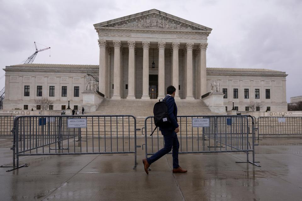 A man walks past the Supreme Court on Feb. 22, 2023.