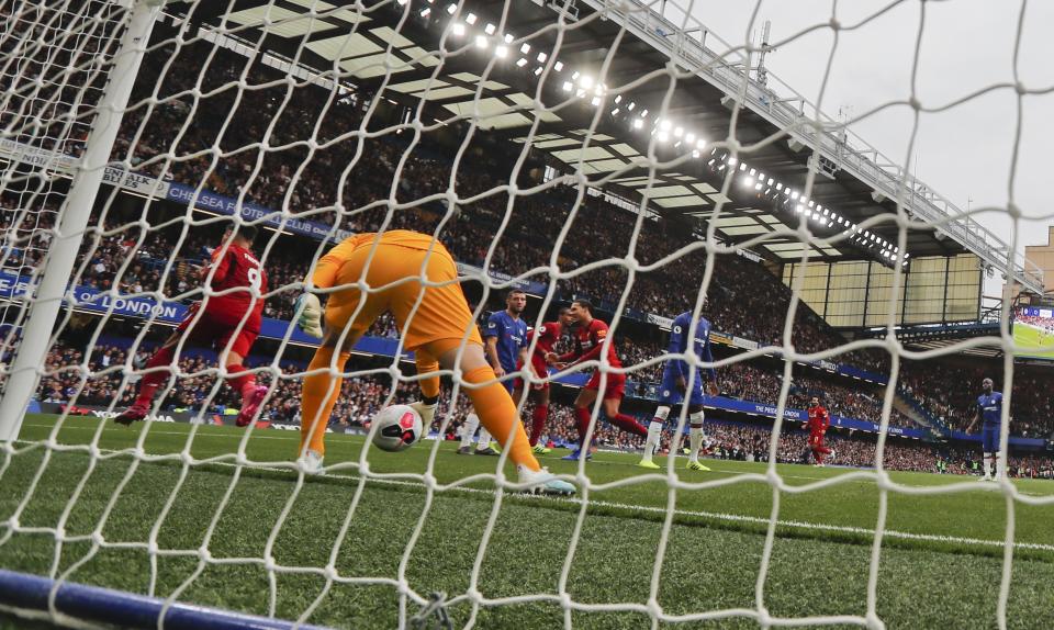 Liverpool's Roberto Firmino celebrates after scoring his side's second goal during the British Premier League soccer match between Chelsea and Liverpool, at the Stamford Bridge Stadium, London, Sunday, Sept. 22, 2019. (AP Photo/Frank Augstein)