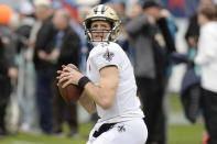 FILE - In this Dec. 22, 2019, file photo, New Orleans Saints quarterback Drew Brees warms up for the team's NFL football game against the Tennessee Titans in Nashville, Tenn. Between them, Tom Brady and Brees have played 38 pro football seasons, 39 if you count 2008 when the New England star wrecked his knee in Week 1, and could be doing so against each other on Feb. 2 in a little thing called the Super Bowl. (AP Photo/Mark Zaleski, File)