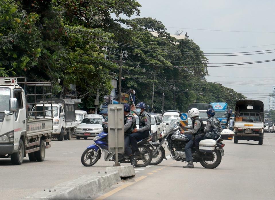 Armed police on patrol in Yangon on Tuesday (EPA)