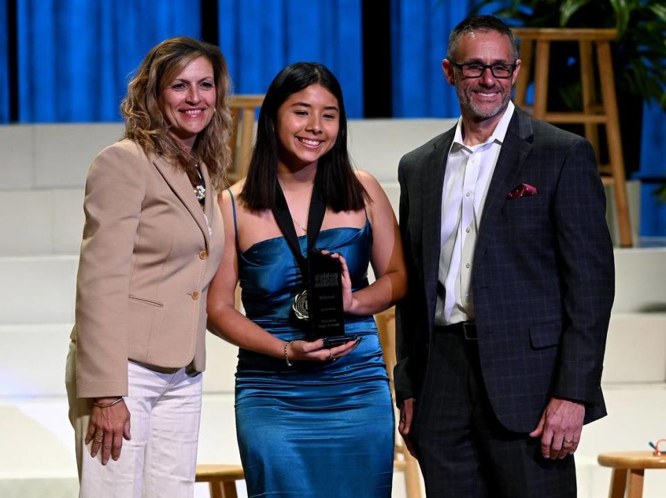 2023 Golden Herald Award winner in Athletics Jenny Martinez with presenters Jackie Barron and Tom McDougal Thursday night.