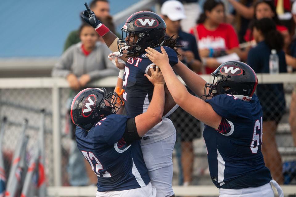 West's Marshaun Bowers (2) celebrates after scoring a touchdown during a high school football game between Farragut and West held at West High in Knoxville on Friday, September 1, 2023.