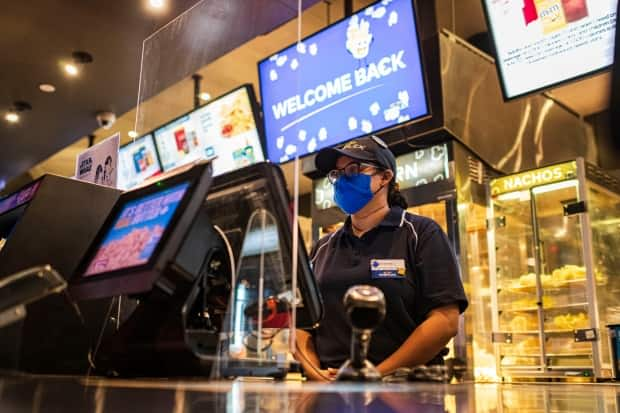 Movie theatres in Quebec's red zones are allowed to reopen, but they can't sell food and popcorn.  (Christopher Katsarov/The Canadian Press - image credit)