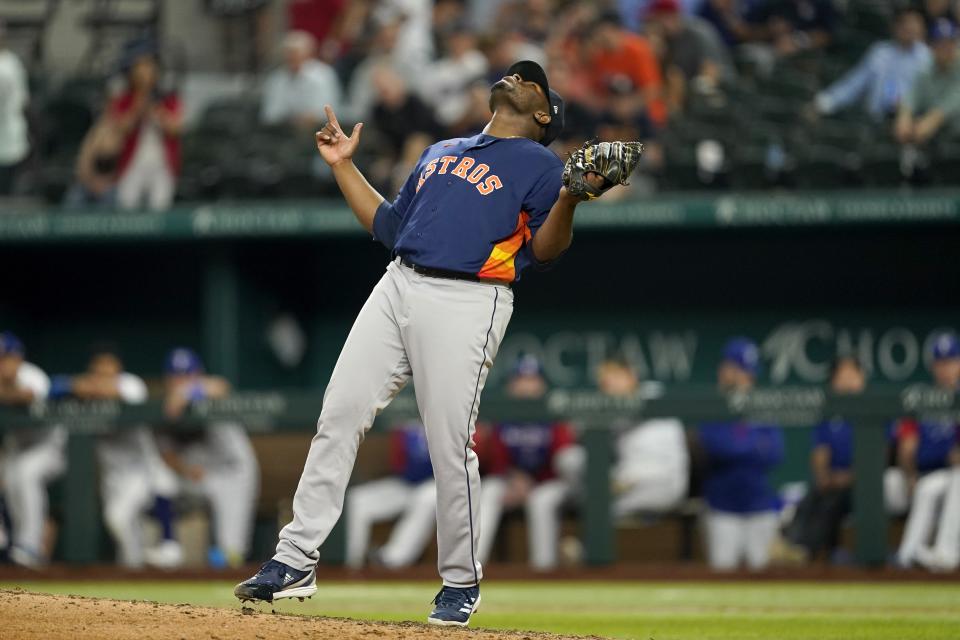 Houston Astros' Hector Neris celebrates the final out in the team's 4-2 win in a baseball game against the Texas Rangers in Arlington, Texas, Tuesday, Aug. 30, 2022. (AP Photo/Tony Gutierrez)