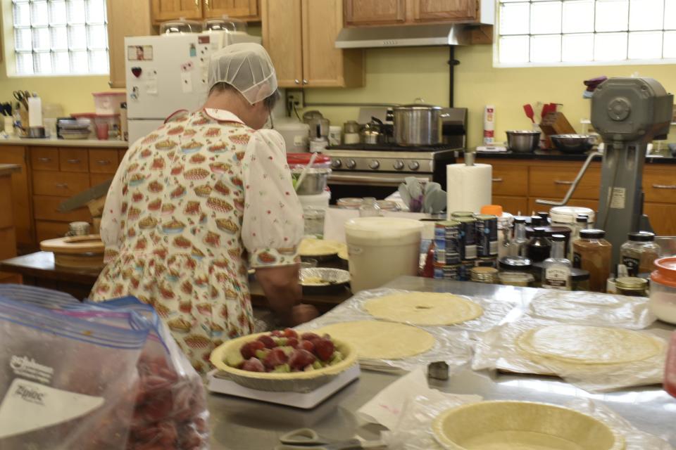 Ailene Herr making strawberry rhubarb pies at SommHerr Bakery in Gosport the afternoon of June 8. It was late afternoon and she had made 40 pies so far that day.