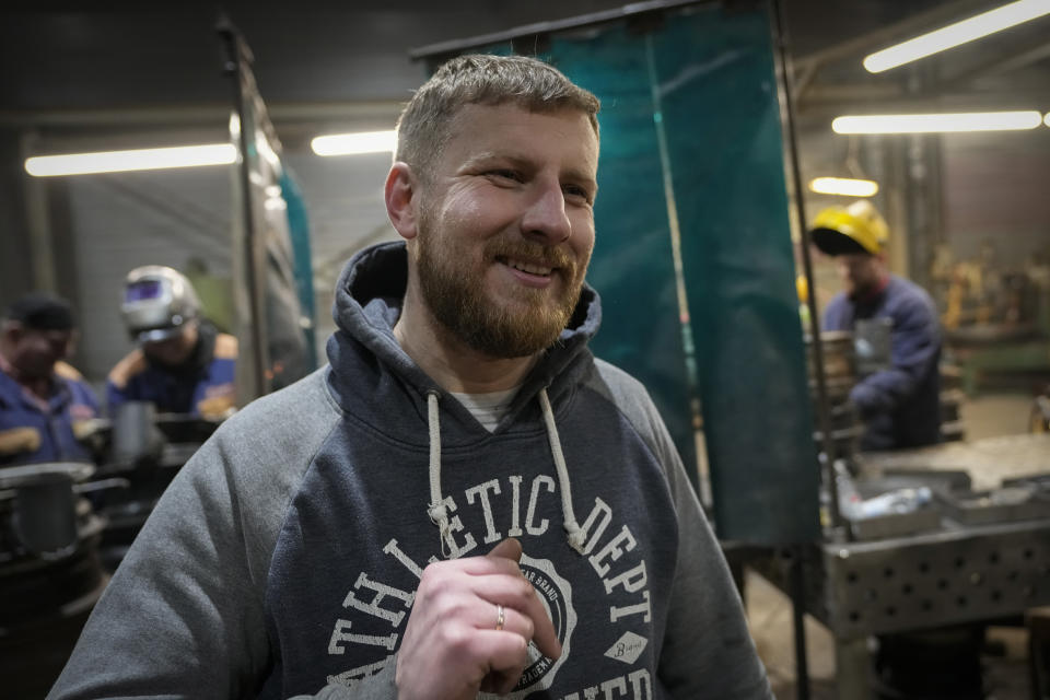 Volunteer and a product manager at the local metal processing company, Edgaras Liakavicius, speaks during an interview with The Associated Press in a workshop in Siauliai, some 230 km (144 miles) north-west of the capital Vilnius, Lithuania, Thursday, Feb. 2, 2023. Since Russia invaded Ukraine last February, Lithuania, Latvia and Estonia — three states on NATO’s eastern flank scarred by decades of Soviet-era occupation — have been among the top donors to Kyiv. (AP Photo/Sergei Grits)