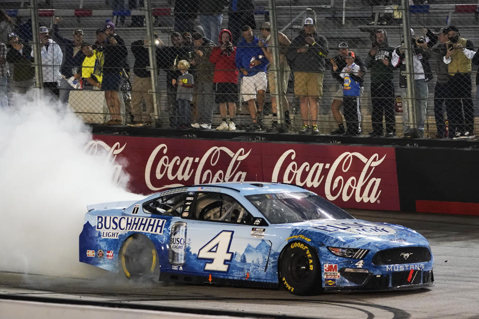 Kevin Harvick does a burnout after winning the NASCAR Cup Series auto race Saturday, Sept. 19, 2020, in Bristol, Tenn. (AP Photo/Steve Helber)