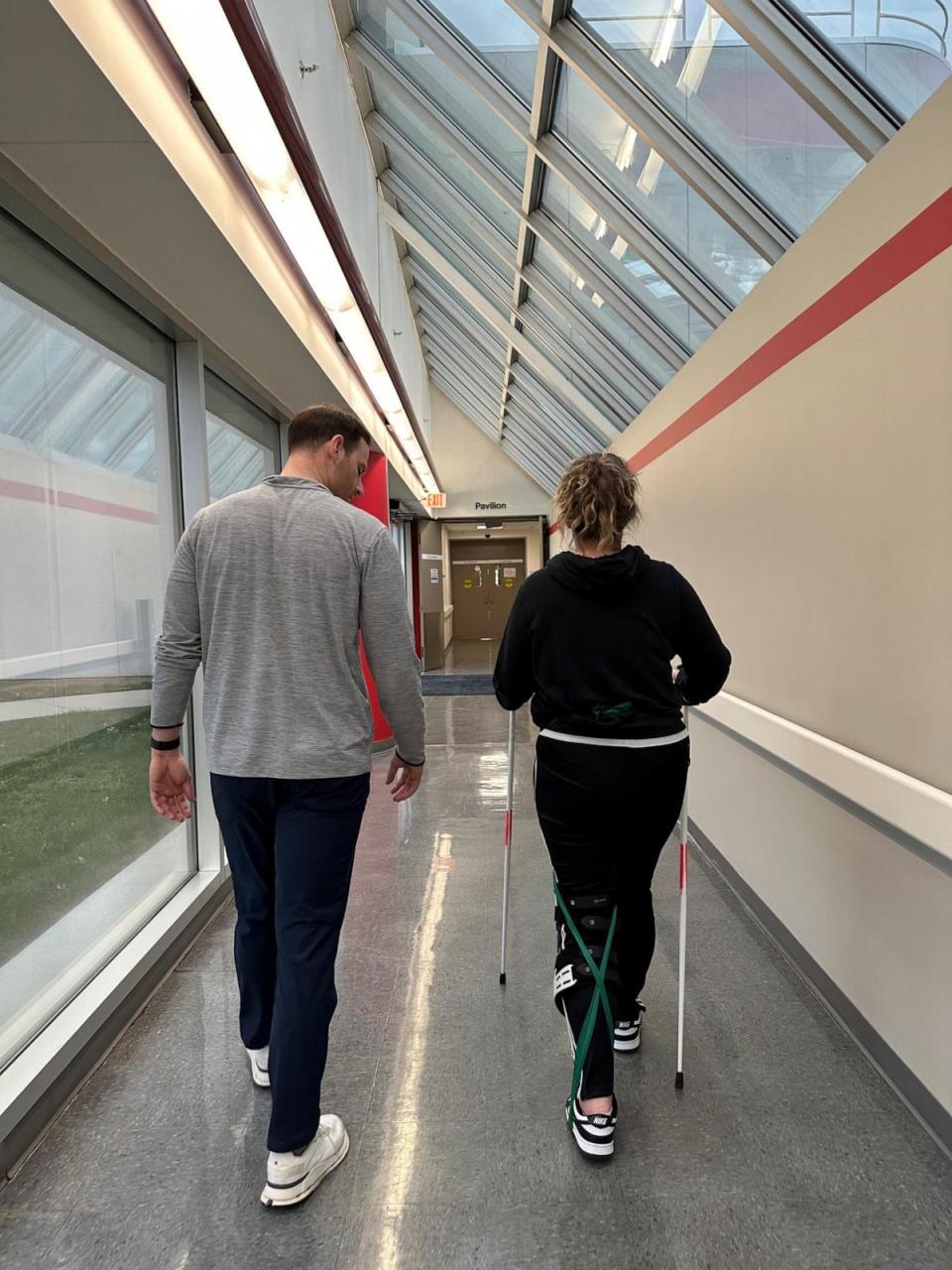 PHOTO: Leah Weiher is pictured walking alongside her physical therapist Casey Perch at the Ohio State University Wexner Medical Center Outpatient Neurologic Rehabilitation. (Courtesy Leah Weiher )