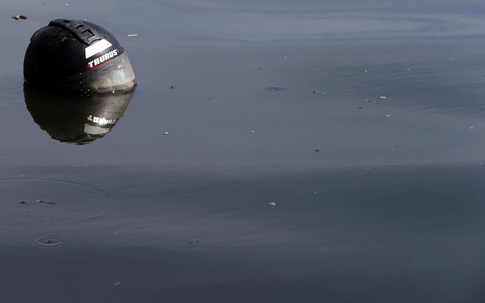 A helmet is seen at the Guanabara Bay in Rio de Janeiro March 12, 2014. REUTERS/Sergio Moraes