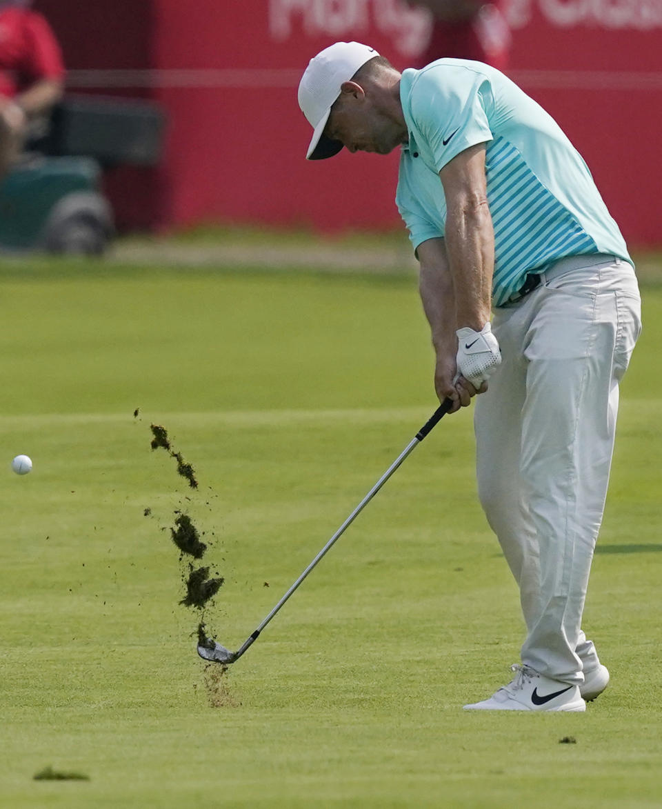 Alex Noren of Sweden his his approach shot onto the 18th green during the final round of the Rocket Mortgage Classic golf tournament, Sunday, July 4, 2021, at the Detroit Golf Club in Detroit. (AP Photo/Carlos Osorio)