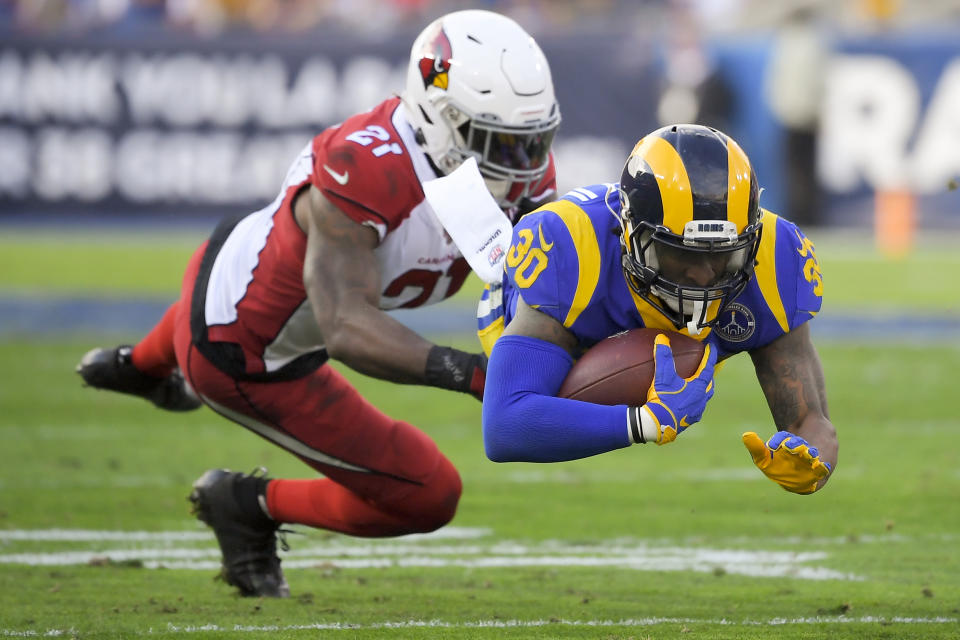 Los Angeles Rams running back Todd Gurley, right, is tackled by Arizona Cardinals cornerback Patrick Peterson during first half of an NFL football game Sunday, Dec. 29, 2019, in Los Angeles. (AP Photo/Mark J. Terrill)