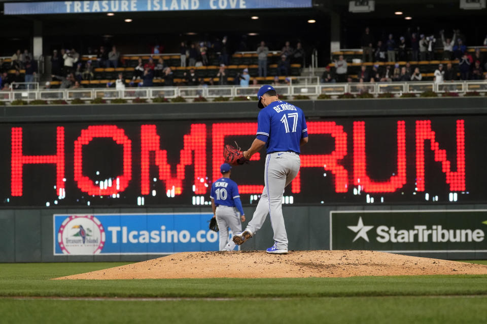 Toronto Blue Jays pitcher Jose Berrios sweeps the mound with his foot after giving up a three-run home run to Minnesota Twins' Byron Buxton in the third inning of a baseball game, Friday, Sept. 24, 2021, in Minneapolis. (AP Photo/Jim Mone)