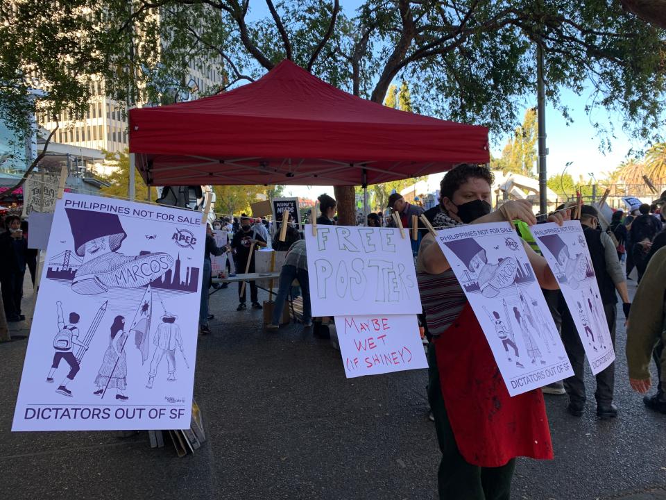 A silk-screen poster collective offering free posters at a protest march and rally on Sunday, November 12, 2023 in San Francisco against the Asia Pacific Economic Cooperation forum. The event runs from November 11 through 17th and features leaders from 21 member economies discussing trade and business.