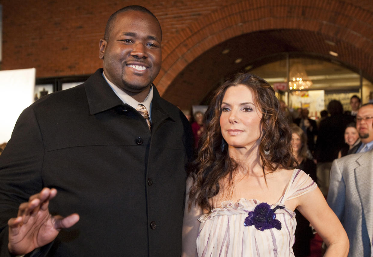 Actor Quinton Aaron with Sandra Bullock at The Blind Side premiere in New Orleans, Louisiana.