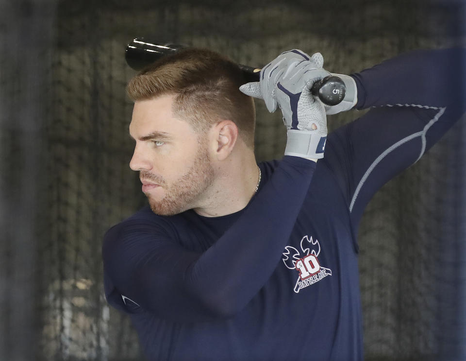 Atlanta Braves' Freddie Freeman takes his first swings of baseball spring training after arriving for camp Sunday, Feb. 16, 2020, in North Port, Fla. (Curtis Compton /Atlanta Journal-Constitution via AP)