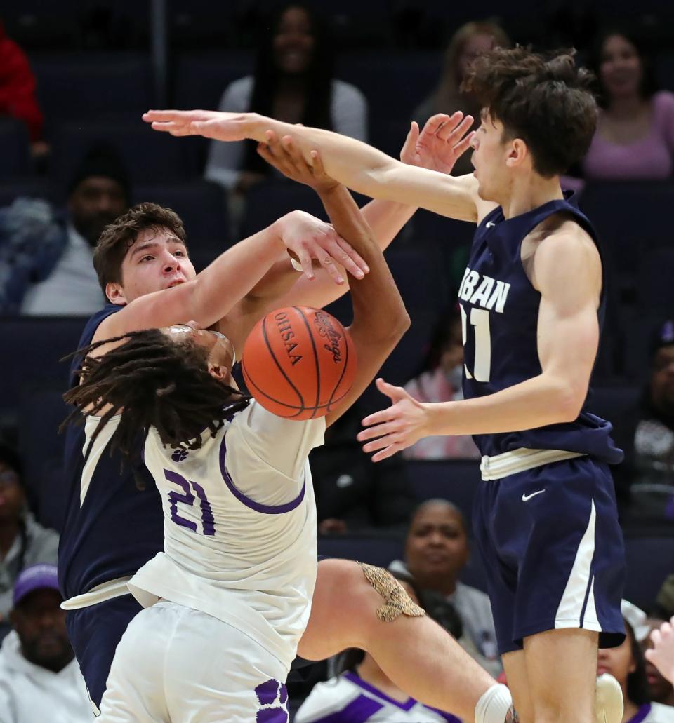 Hoban's Sam Greer, left, and Andrew Griffith stuff a second-half shot by Pickerington Central's Devin Royal in a Division I state final March 19 in Dayton.