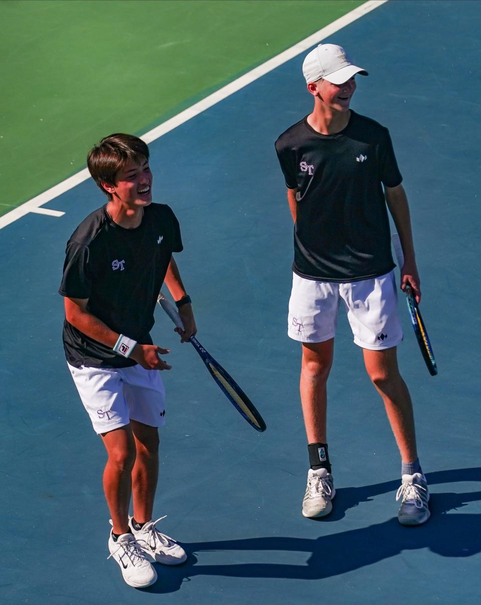 Bloomington South’s Ethan Payton and Evan Kantor smile after winning a point during their No. 1 doubles match during the IHSAA Boys’ tennis sectional championship at South on Saturday, Sept. 30, 2023.