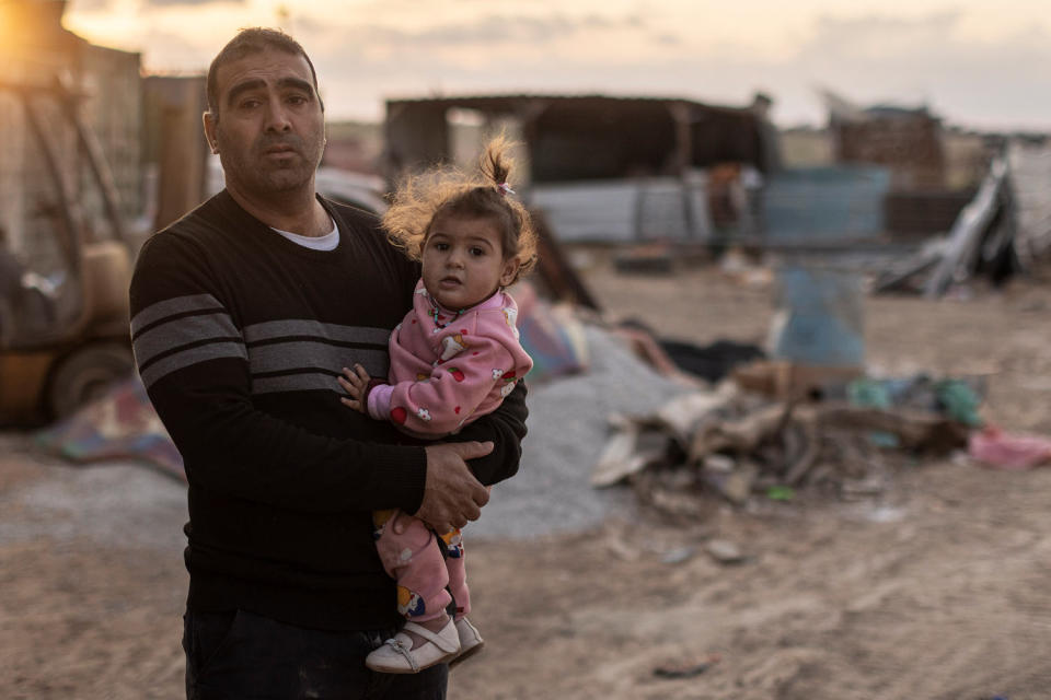 Muhammad Abu Qwaider holding his daughter, Maisa. (Avishag Shaar-Yashuv for NBC News)