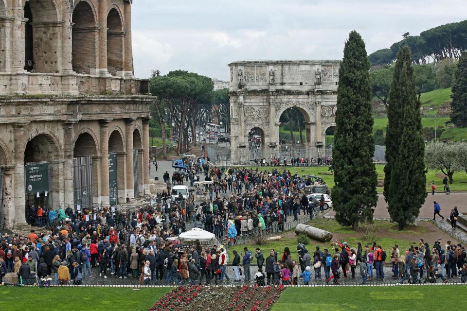 Tourists crowd the Colosseum in Rome Sunday, April 5, 2015. (AP Photo/Alessandro Di Meo, ANSA)