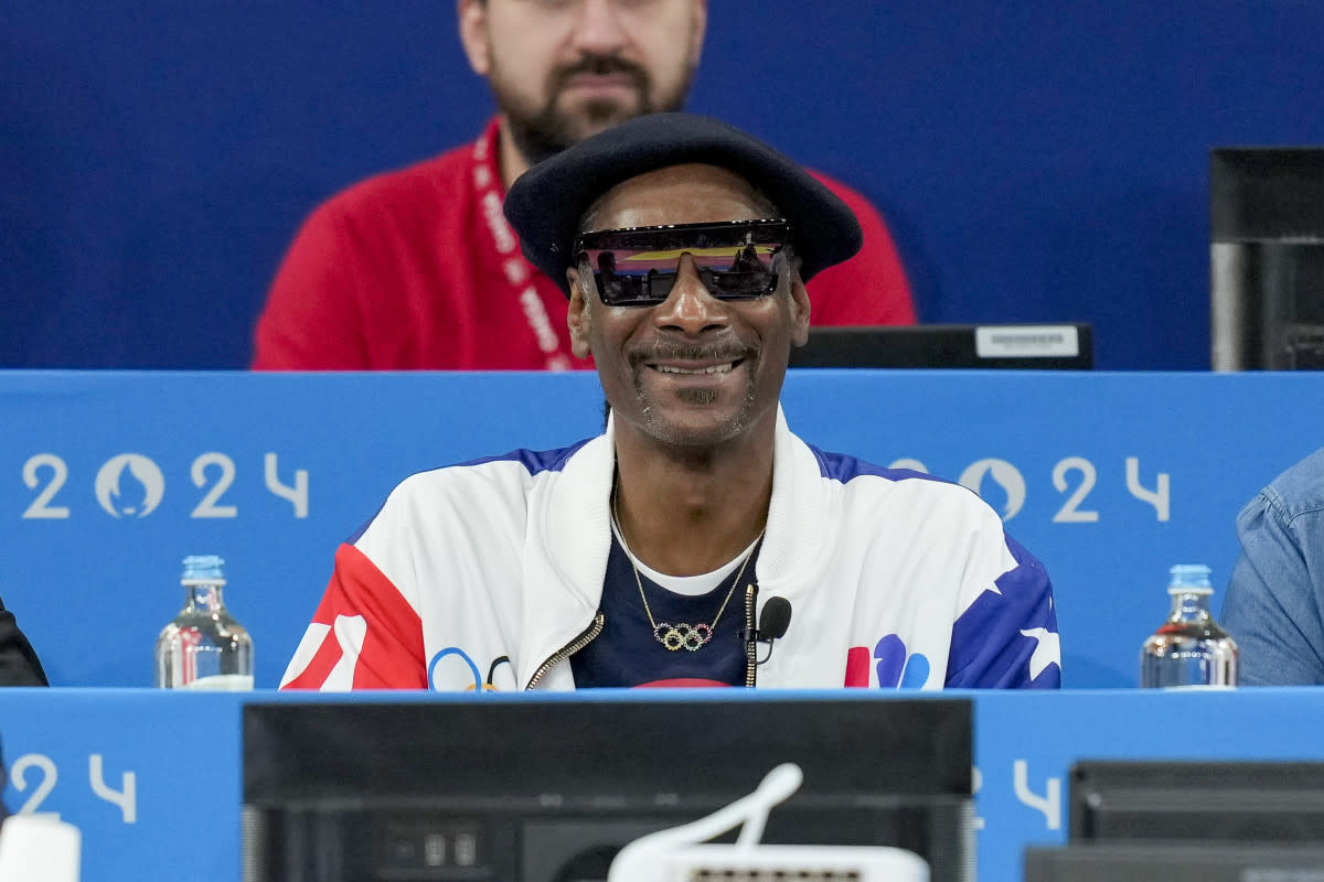 Snoop Dogg at his Olympics commentator desk<p>Alex Gottschalk/DeFodi Images via Getty Images</p>