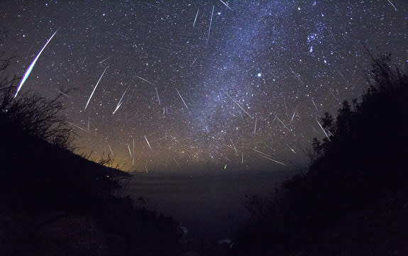 Skywatcher Kenneth Brandon wrote, "This shot is a composite of about 700 frames from a time-lapse I took in Big Sur, CA. I found 61 frames with meteors in them. Then I stacked the frames and created masks for each meteor. " The image was taken