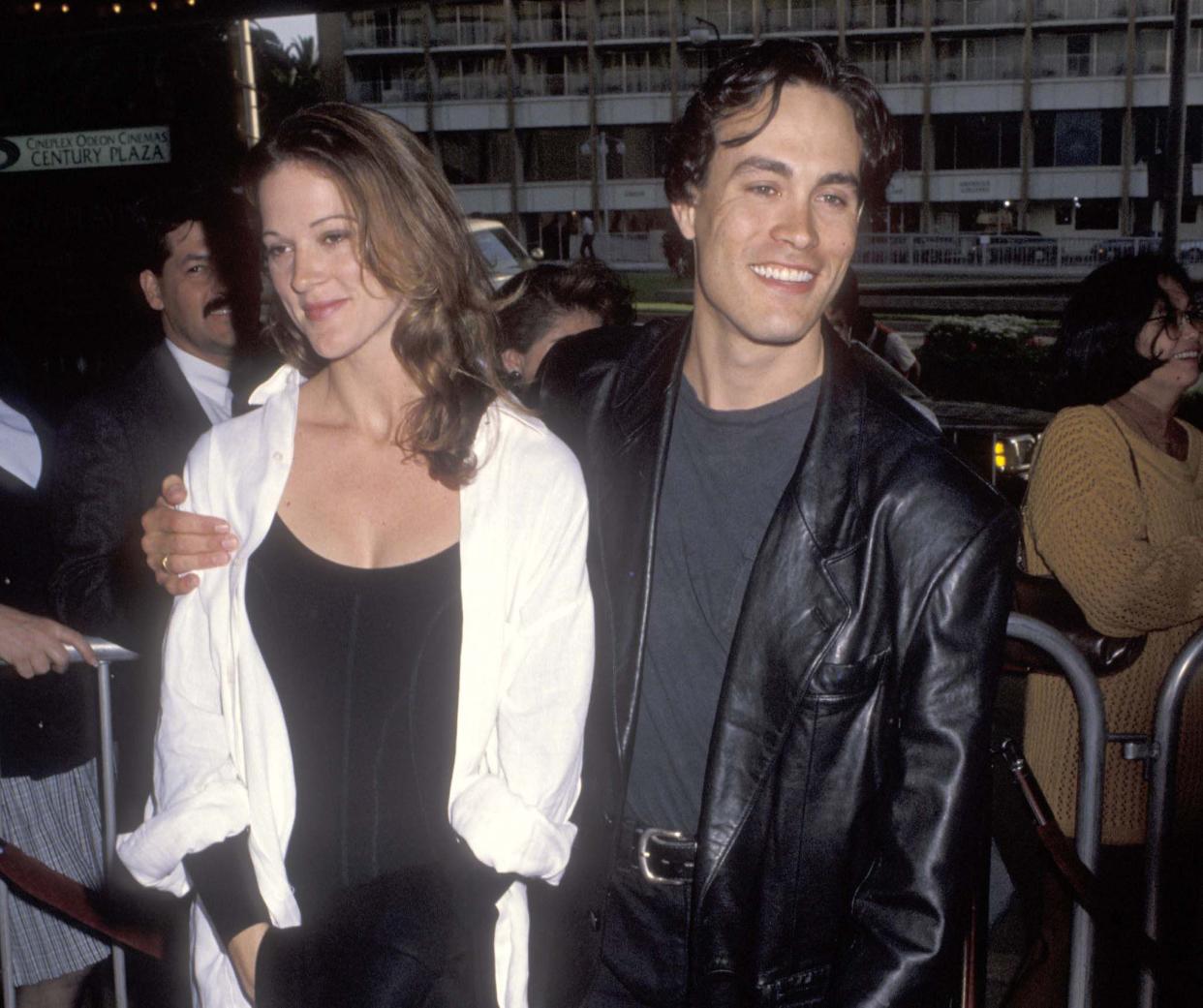 In this file photo, Actor Brandon Lee, right, and Eliza Hutton attend the Alien 3 premiere on May 19, 1992 in Century City, Calif.