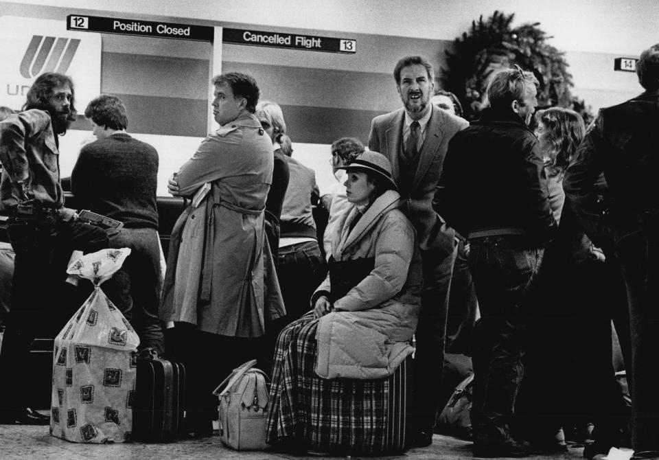 Just for special snow days, United Airlines now has signs and lines to handle passengers with cancelled flights. They had four lines going and about six agents handling the frustrated travelers on Nov. 12, 1984.