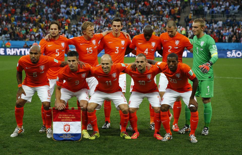 Netherlands national soccer players pose for a team photo before their 2014 World Cup semi-finals against Argentina at the Corinthians arena in Sao Paulo