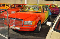 <p>We told you the Sheikh likes the colors of the rainbow. Used for parades and special events, this Mercedes-Benz W126 received a <strong>multi-colored paint job</strong> in addition to a wider rear track and a pair of side exhaust pipes. Note that the interior matches the exterior; the dashboard is orange, the front seats are yellow, the rear seats are green and the parcel shelf is blue.</p>