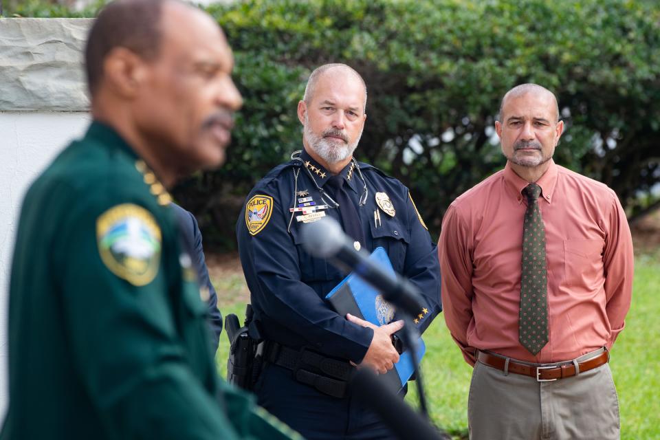 Tallahassee Chief of Police Lawrence Revell and Leon County Schools Superintendent Rocky Hanna listen as Leon County Sheriff Walt McNeil speaks at a press conference for the launch of a website with mental health resources and warnings about violent video games and addiction on steps of the Historic Capitol on Monday, June 12, 2023. 