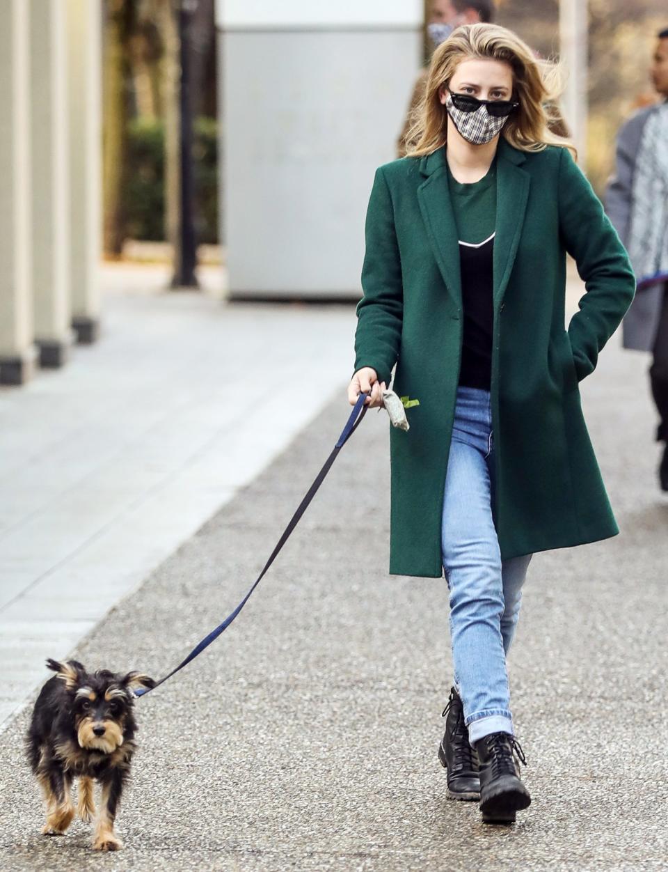 <p>Lili Reinhart makes her dog walk the catwalk on Saturday while taking her pup for a stroll in Vancouver, Canada.</p>